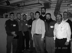 Group of men standing together at the leadership seminar