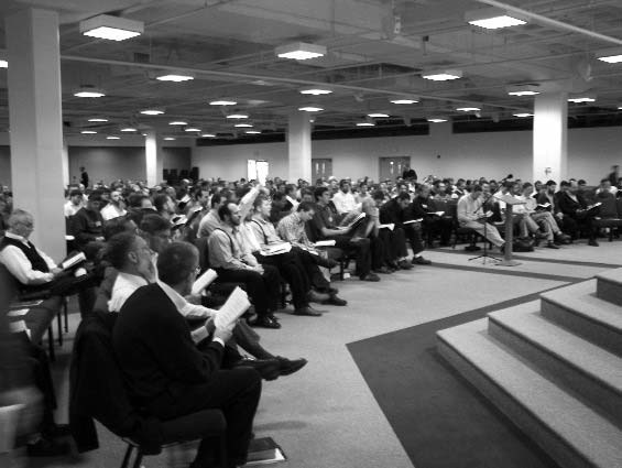 Seminar attendees seated in a large meeting hall