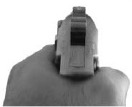 Handgun pointed toward the right