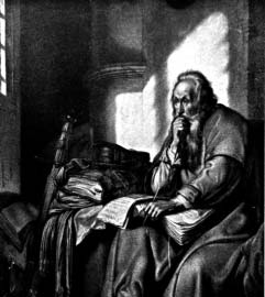A seated man reads and writes at a desk beside a window.