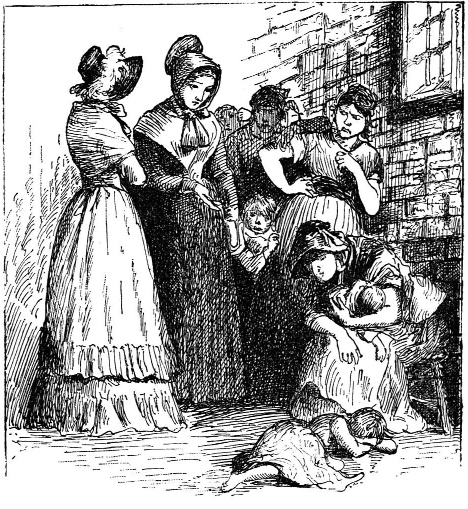 Women and children gathered in a bare room