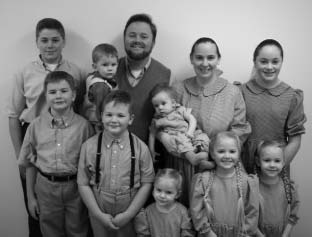 A family posed together for a group portrait