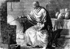 A seated refiner working beside a furnace