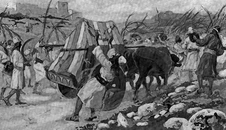 An ox-drawn cart with men walking beside it