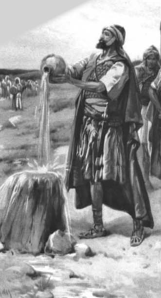 A man pouring water onto the ground