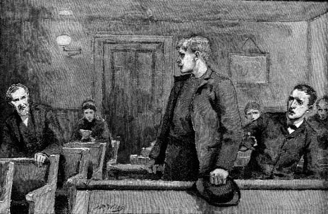 A man standing among seated men in a room