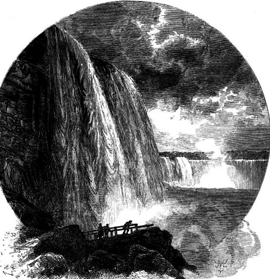Waterfalls seen from a rocky overlook with several figures.