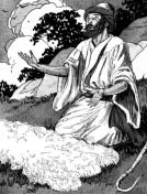 A man kneeling beside a fleece spread on the ground.