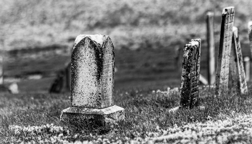 A row of weathered gravestones