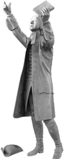 An illustration of John Wesley preaching with a book raised in one hand