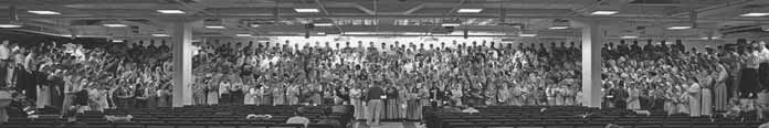 Panoramic photograph of Youth Bible School attendees in a hall