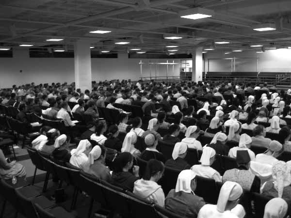 A large audience seated in a hall at Youth Bible School
