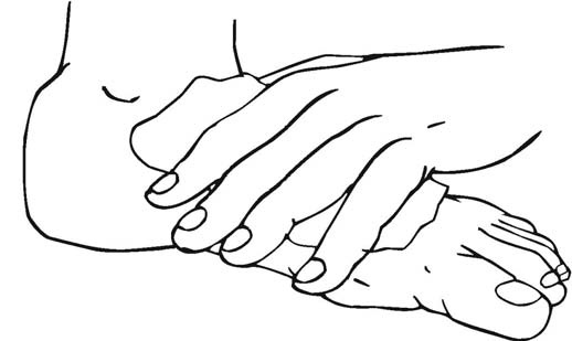 A larger hand resting over a smaller hand