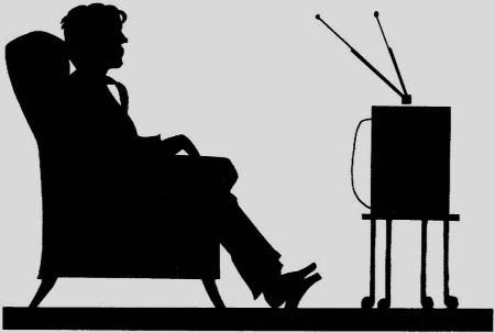 A seated person watching a television