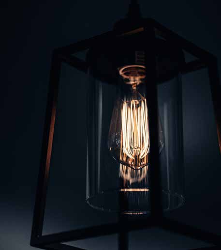 A glowing bulb inside a dark lantern.