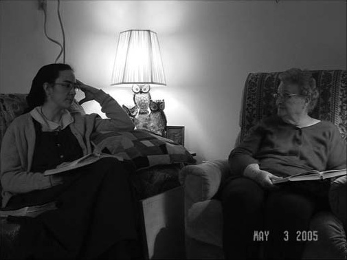 Two women sitting together in a living room.