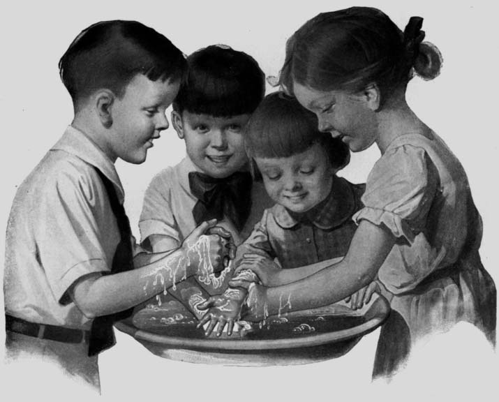 Four children gathered around a basin