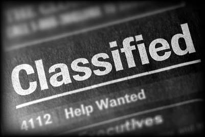 A newspaper classified section with a Help Wanted listing