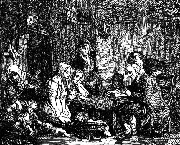 Family gathered around a table while a man reads from a book