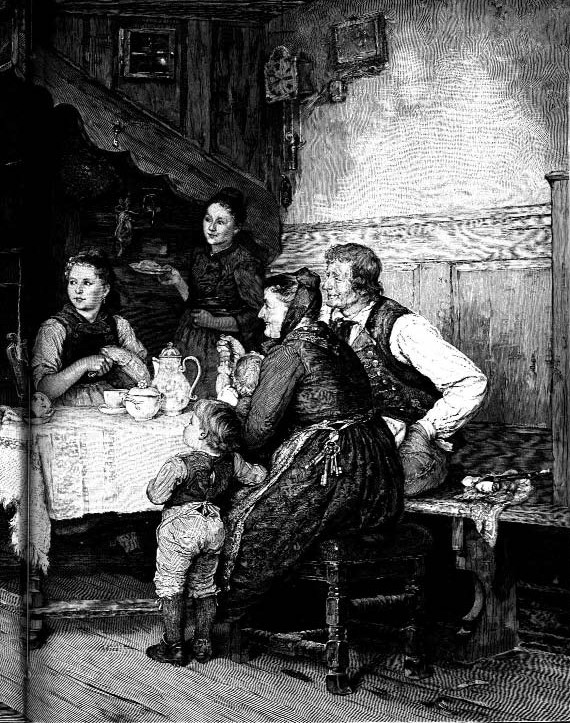 Adults and children gathered around a table with hands clasped
