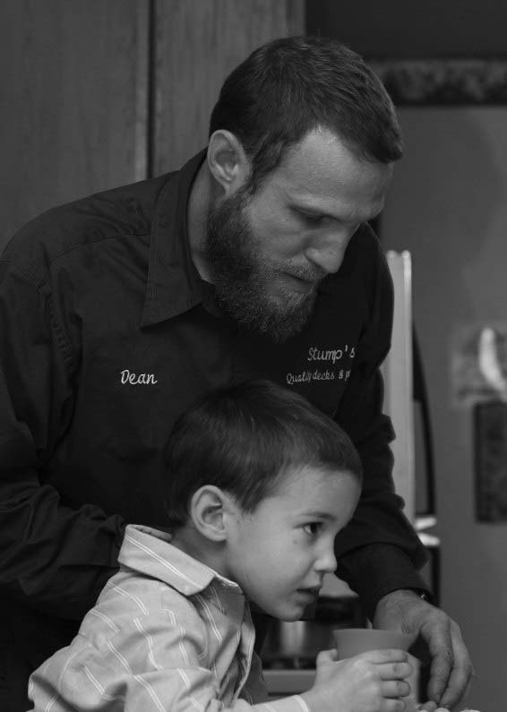 A man sitting with a young child