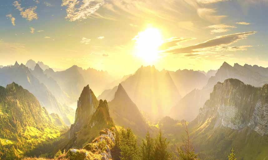 Sunrise over rugged mountain peaks