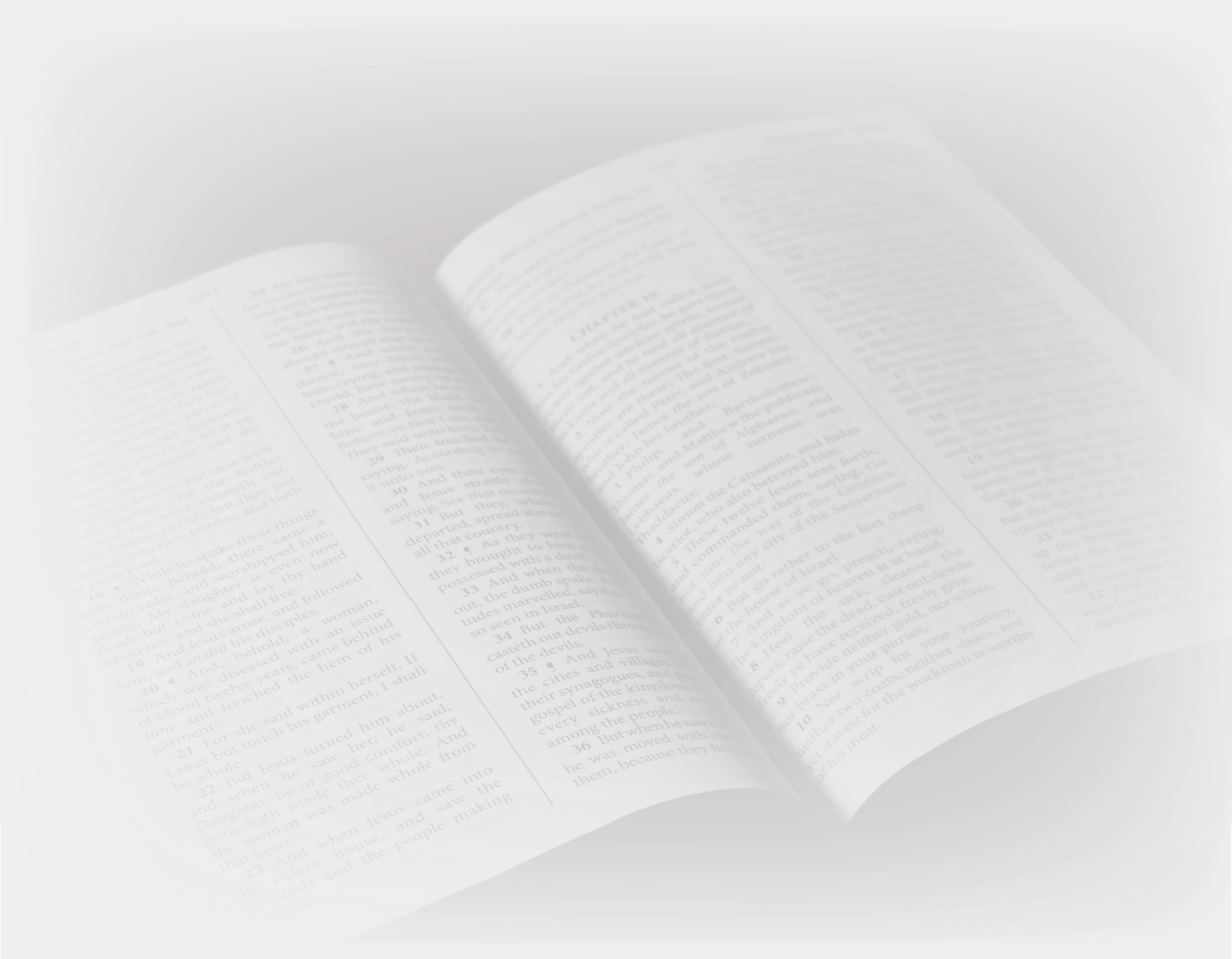 An open Bible with red-letter text