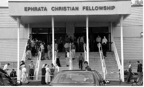 People gather on the steps of Ephrata Christian Fellowship.