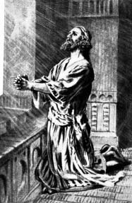 A man kneeling in prayer beside a balcony.
