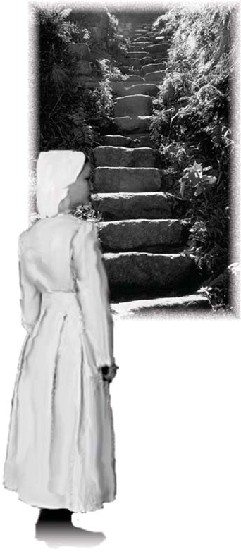 A woman in a pale dress stands by a steep garden stairway