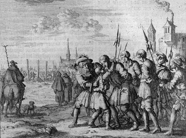 Armed men leading a prisoner