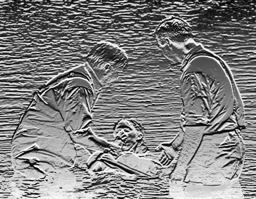 Two people helping another person rise from water