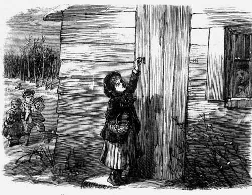A person reaching toward a large wooden door while others look on