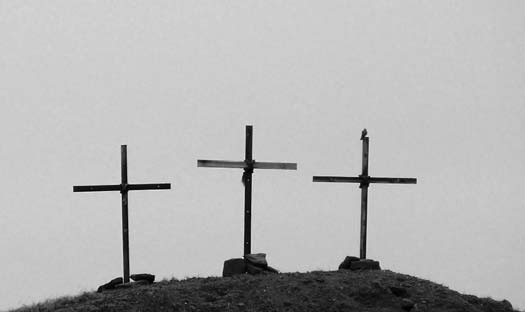 Three crosses standing on a hill