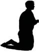 A person kneeling in prayer