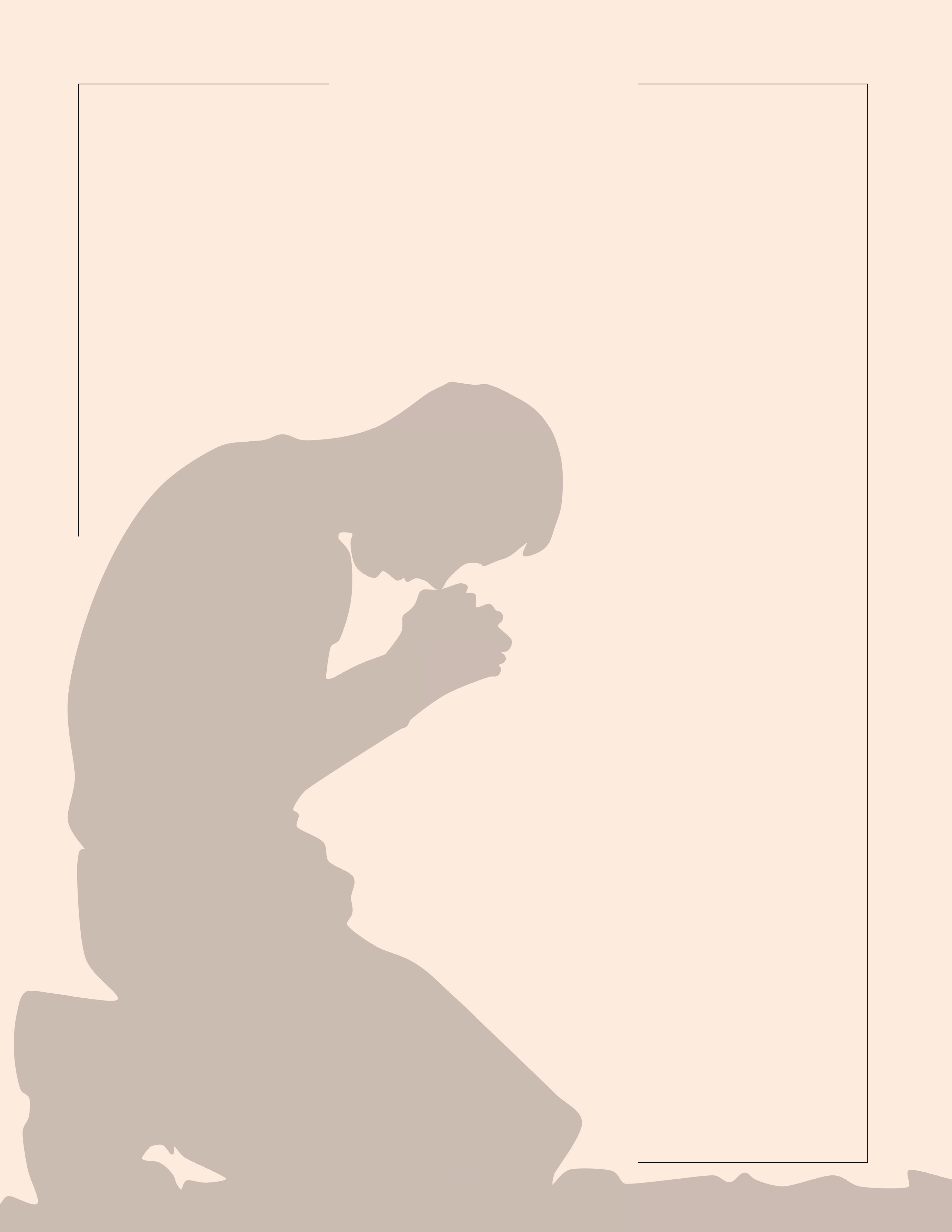 A kneeling man praying in silhouette