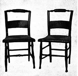 An illustration of two empty wooden chairs