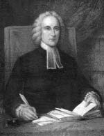 Portrait of a man in clerical clothing seated at a desk