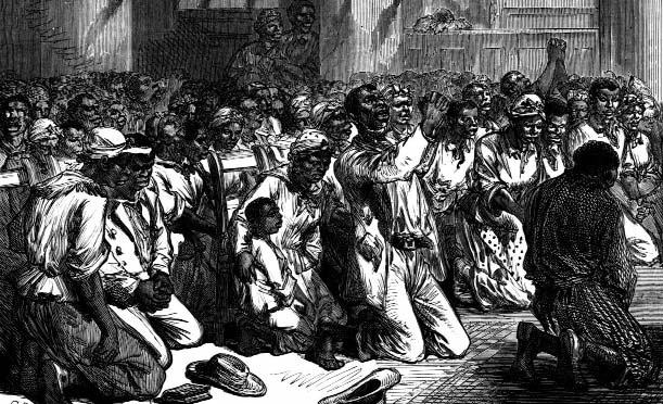 A congregation kneels in prayer