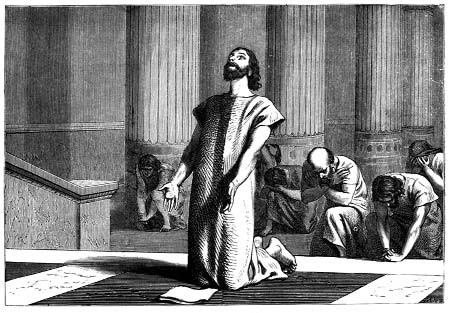 A man praying with other kneeling people behind him