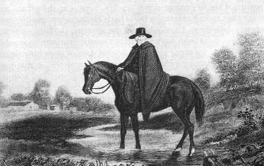 A circuit rider sits on his horse outdoors
