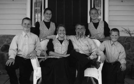 Family seated together on a porch