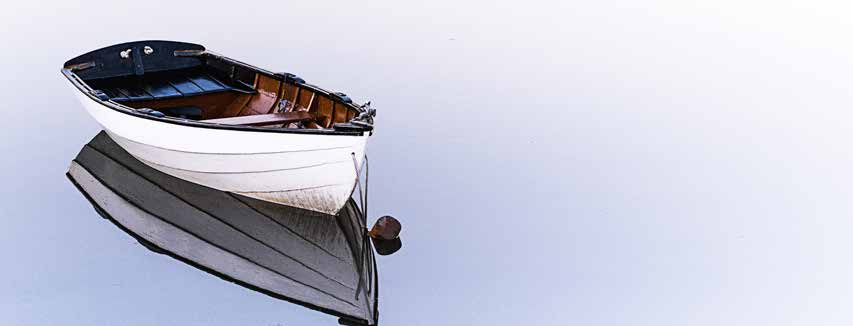 Rowboat reflected in calm water