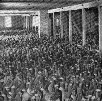 Revival meeting crowd inside a large tent