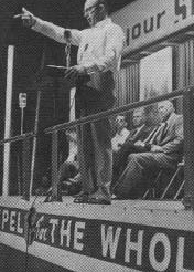 Preacher addressing a revival gathering