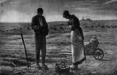 Two people bowing in prayer beside a field