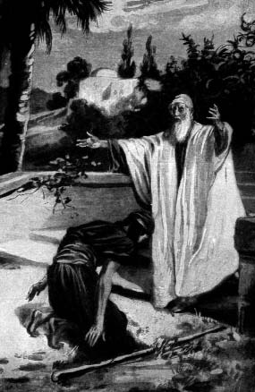 A robed man stands with arms extended beside a kneeling figure outdoors