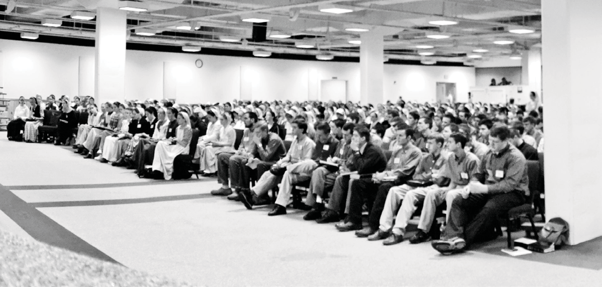 Bible School attendees seated in a large hall
