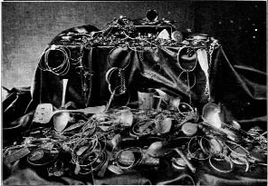 Jewelry and ornaments laid out on a table
