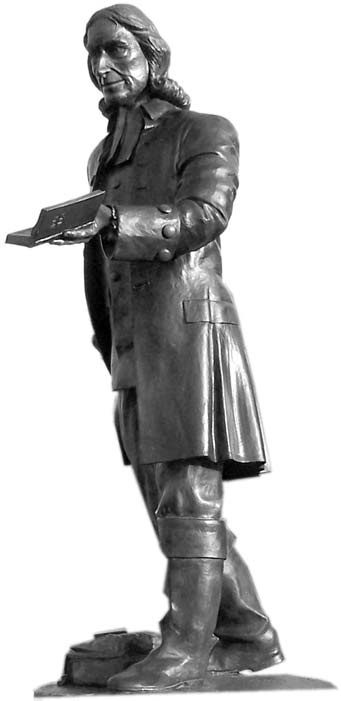 Statue of John Wesley holding an open book